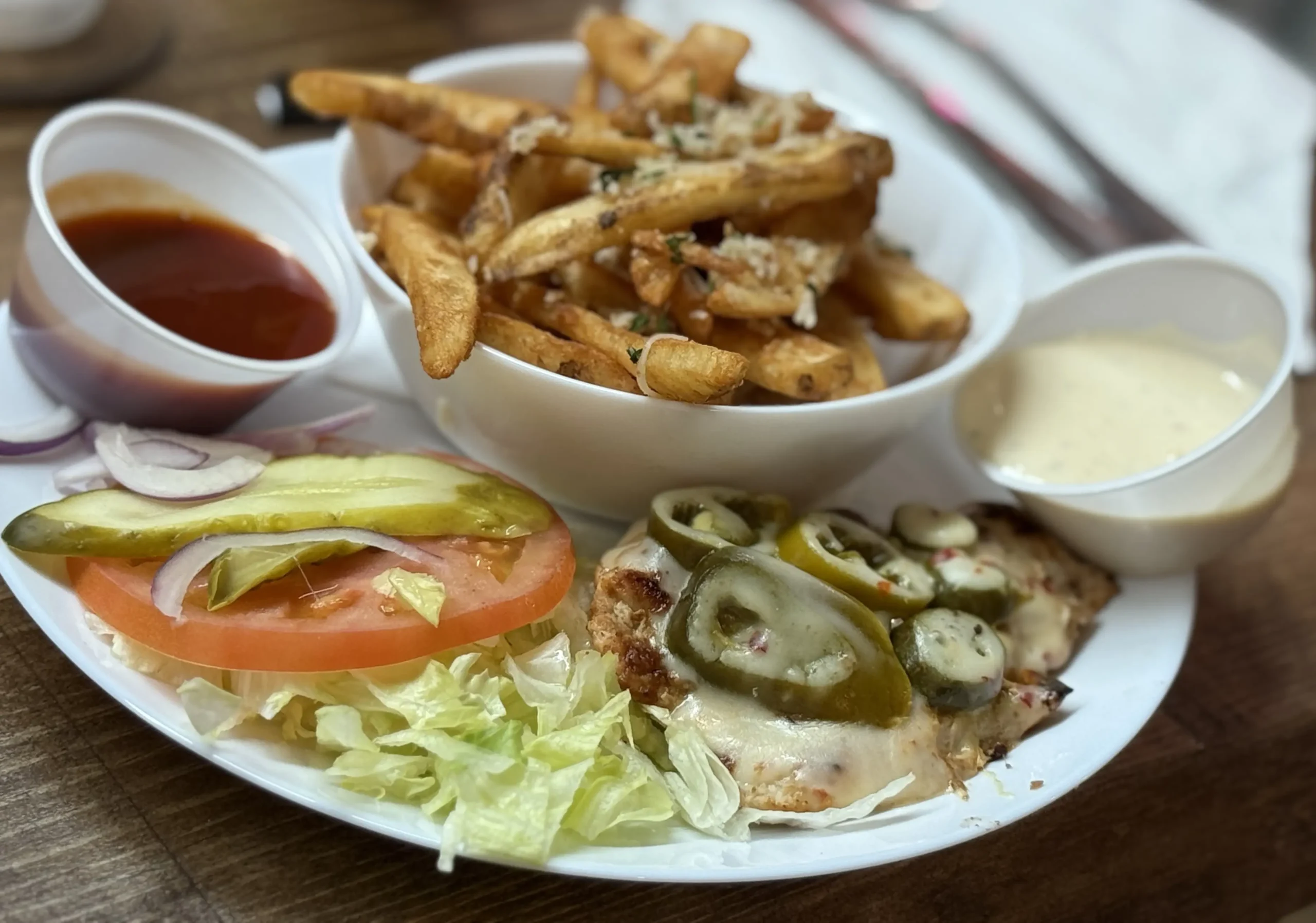 Cajun Grilled Chicken Burger (No Bun), Parmesan Fries with Garlic Aioli and BBQ Sauce sides, Image 01